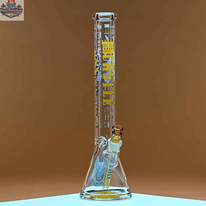 Castle Glassworks 18-inch Anubis beaker bong made of 9mm thick glass with an amber background in the right photo.