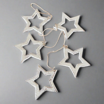 Hanging wooden star decor string by Suzie Blue Canada, open wooden stars for stylish home decoration.