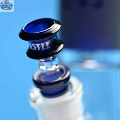 Blue frosted beaker bong by Castle Glassworks, 16-inch tube with detailed glass bowl, on a blue background.