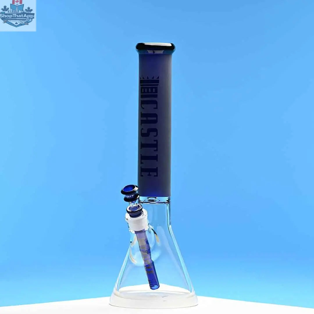 Blue frosted glass beaker bong by Castle Glassworks, 16-inch tube with vibrant blue background, designed for enhanced smoking experience.