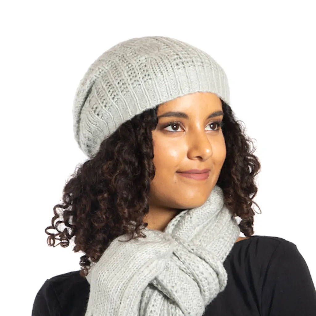 Blue cable knit hat by Suzie Blue Canada featuring a cozy, stylish design perfect for cold weather.