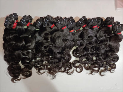 Indian Virgin Bodywave Hair Extensions bundle by Prithvi Mart, showcasing lush, wavy hair bundles with natural shine and texture.