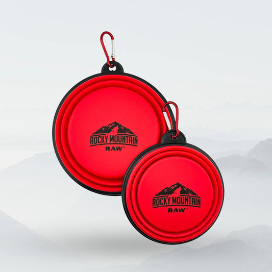 Red foldable dog bowl from ROCKY MOUNTAIN RAW, lightweight and portable for travel, ideal for feeding dogs on the go.