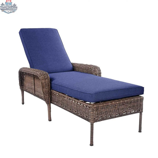 Krikacy Cambridge brown wicker outdoor chaise lounge with indigo cushion, perfect for relaxing in the backyard or patio.