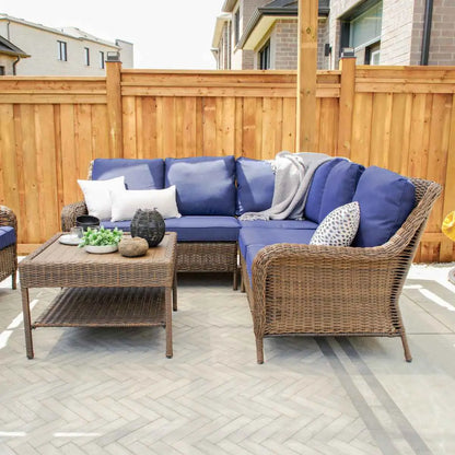 Krikacy Cambridge sectional set with stylish four-piece design and matching coffee table in a modern living room setting.