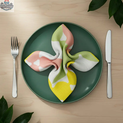 Celebration-style dinner setting with folded printed cotton napkin featuring elegant design, part of Hem And Tassel's dinner napkin collection.