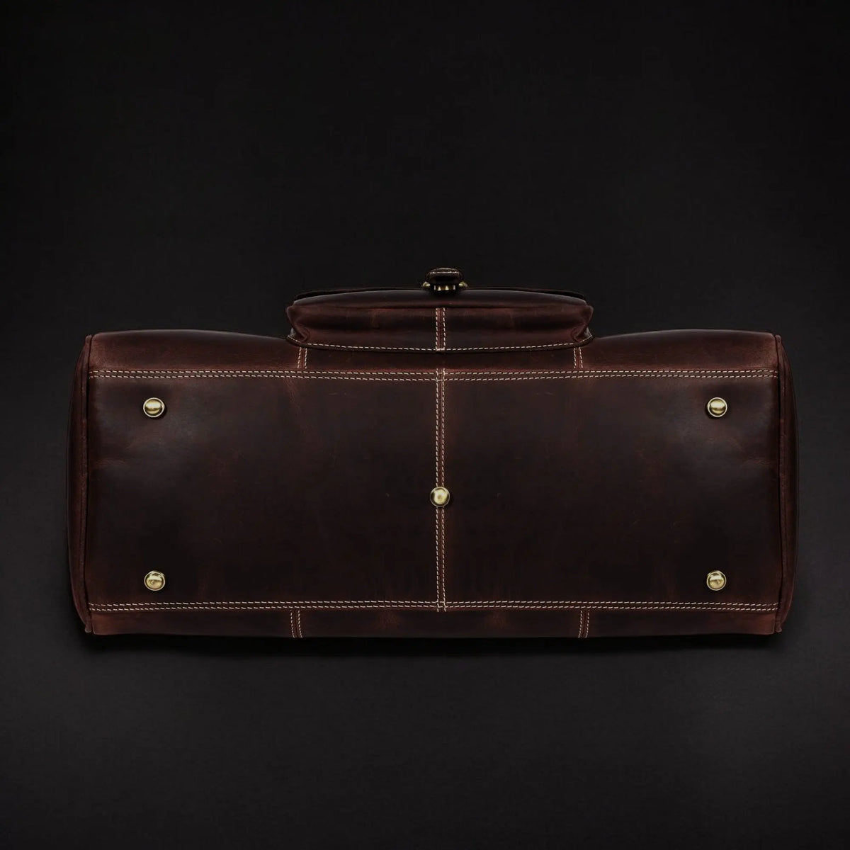 Full-grain distressed brown leather Voyager Duffle bag by NAB Leather, showcasing its spacious design and sturdy hand-stitched details.