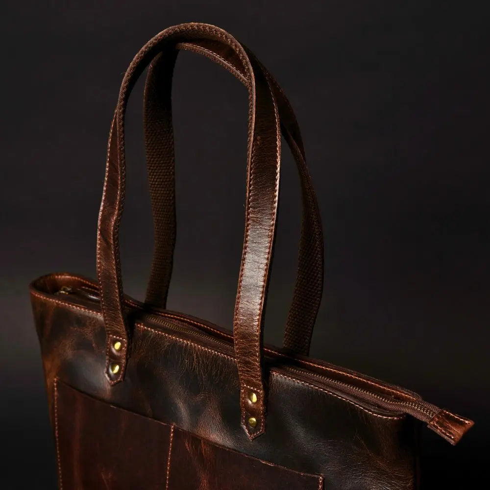 NAB Leather classic brown leather tote bag with sturdy handles, showcasing its spacious interior and timeless design for everyday use.