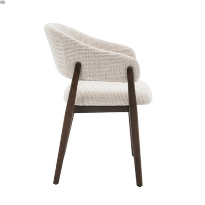 Beige upholstered Fiol dining chair with a dirty oak wood frame by Hygge Design House, showcasing a modern and elegant design.