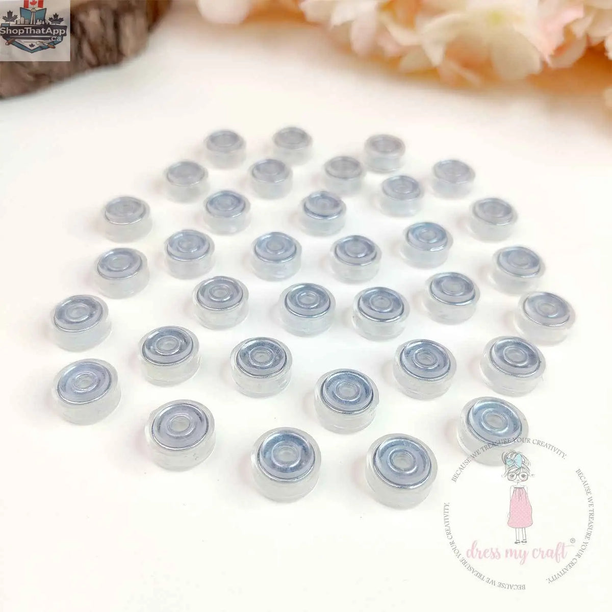 Transparent spinners embellishments from Dress My Craft by Ecstasy Crafts, featuring clear, decorative embellishments for craft projects.