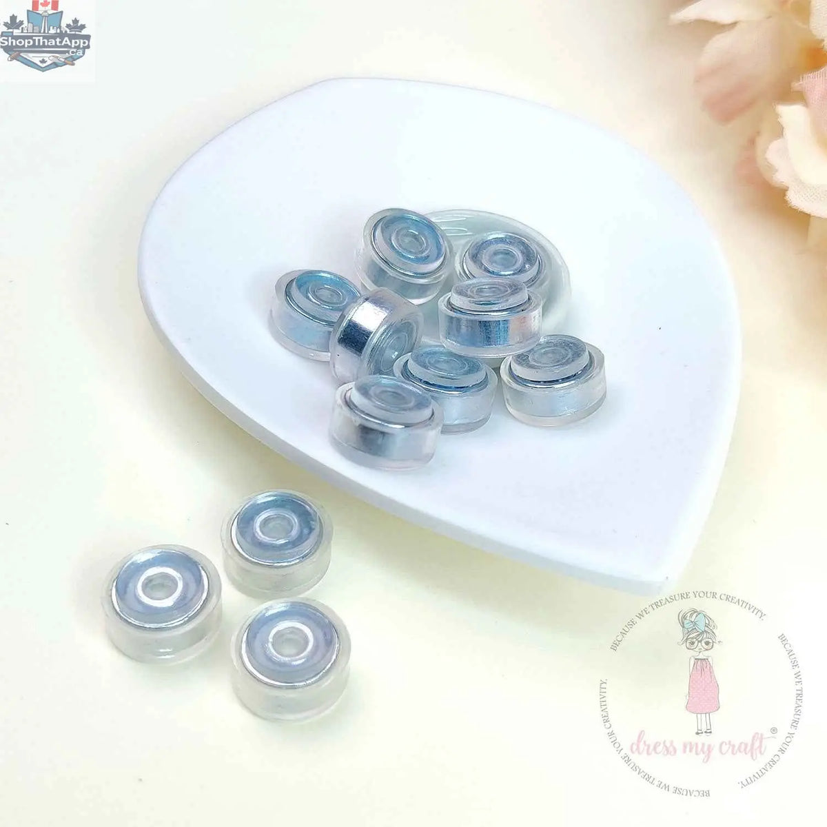 Transparent spinners embellishments by Dress My Craft from Ecstasy Crafts, featuring clear, decorative spinning accents for craft projects.