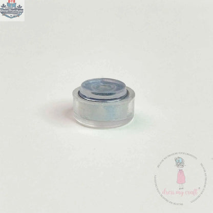 Transparent spinners embellishments from Dress My Craft by Ecstasy Crafts, showing colorful, clear plastic decorative spinner components.