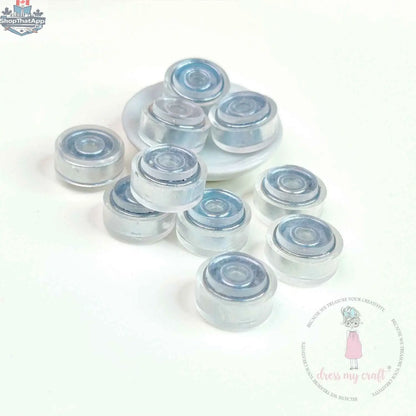 Transparent spinners embellishments by Dress My Craft, Ecstasy Crafts, featuring clear, decorative embellishments for craft projects.