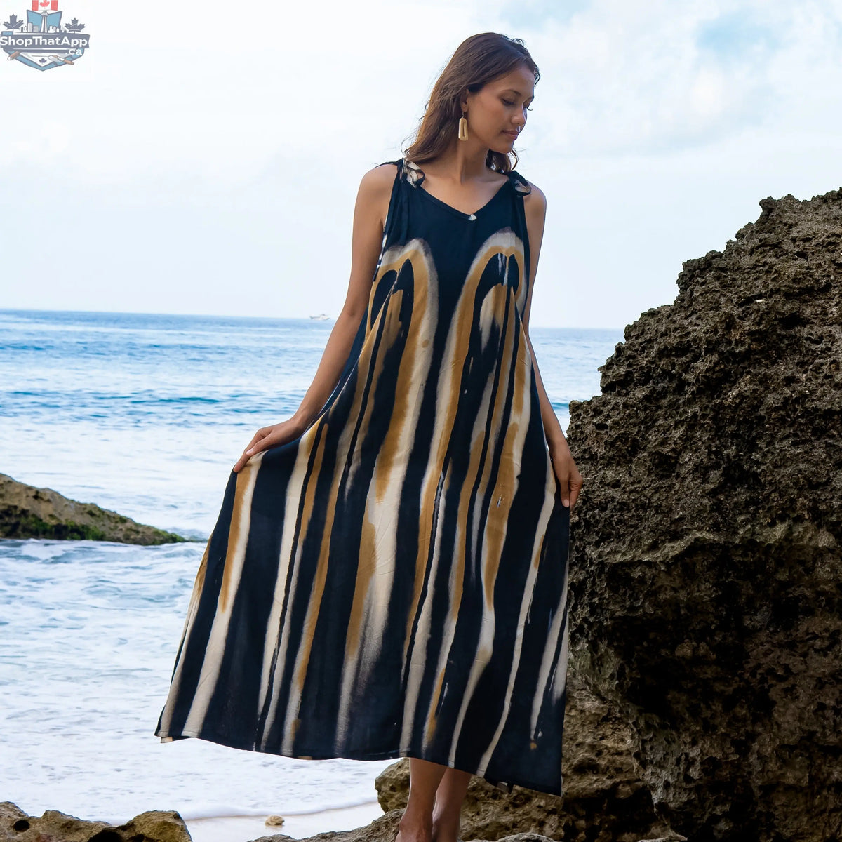 Grey and gold abstract tie dye dress by Suzie Blue Canada, featuring bold patterns and a stylish, flowing design.