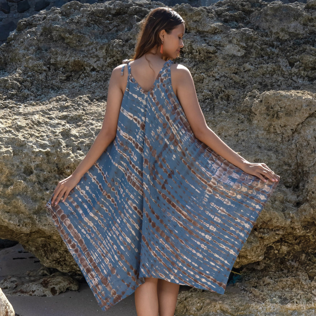 Tan grey tie-dye handkerchief dress by Suzie Blue Canada featuring a stylish and unique fashion statement.