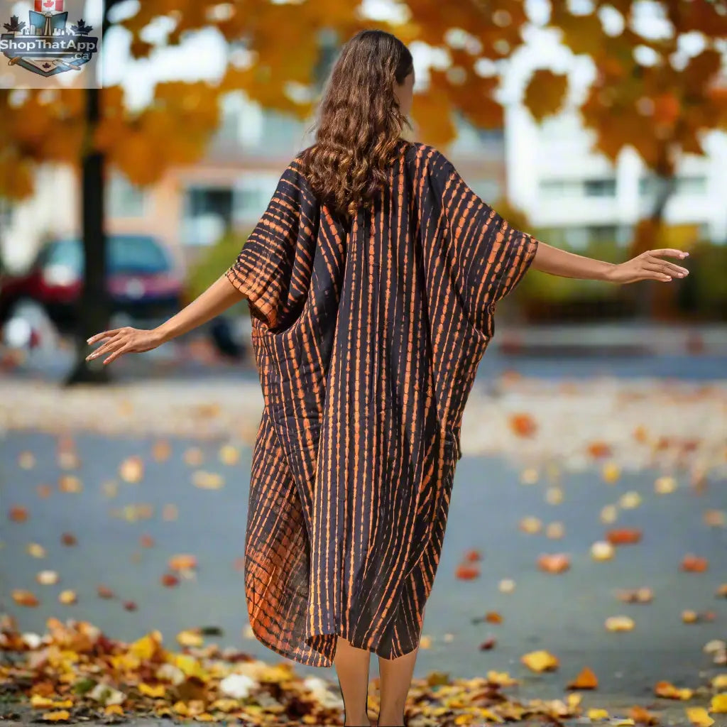 Orange and black tie-dye long kimono by Suzie Blue Canada, featuring a stylish flowy design with a tie waist detail.