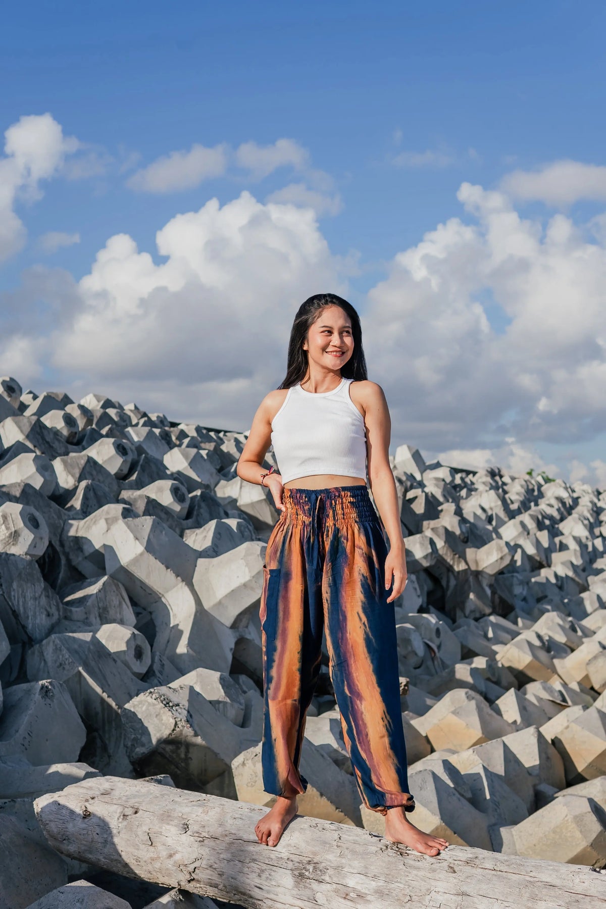 Navy gold tie dye pants by Suzie Blue Canada featuring abstract Bali style, showcasing relaxed fit and vibrant pattern.