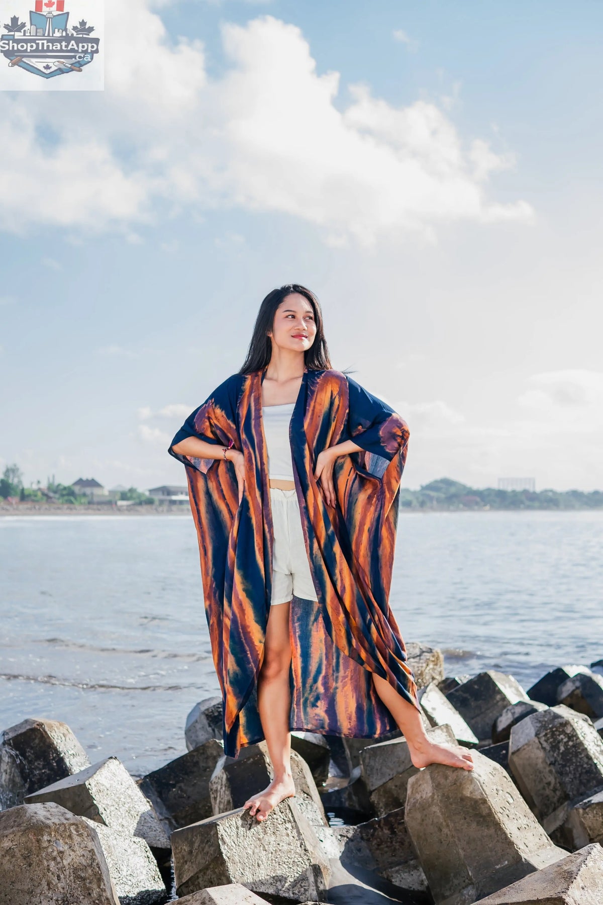 Navy and gold abstract kimono by Suzie Blue Canada, stylish long tie-dye cover-up with flowing fabric and intricate pattern.