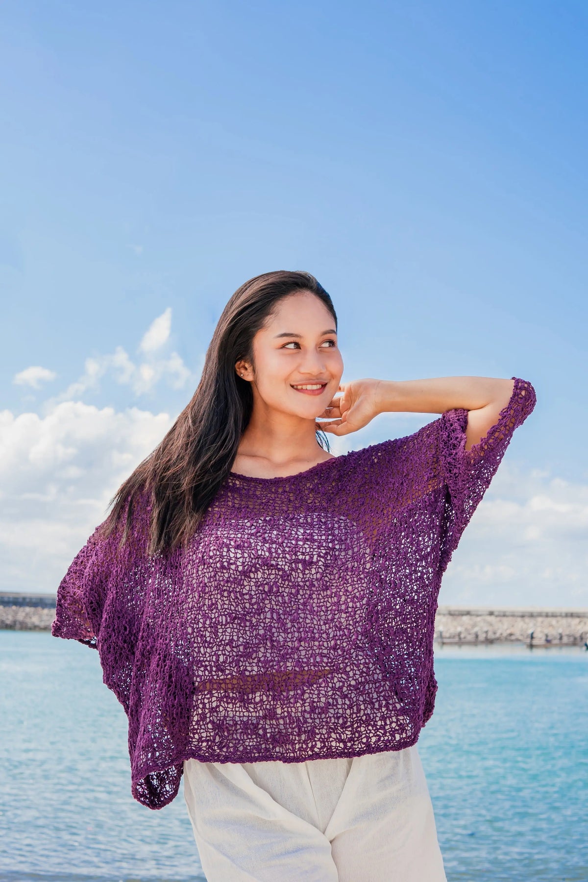 Purple knit top by Suzie Blue Canada featuring a popcorn knit pattern, cozy style perfect for casual or dressed-up occasions.