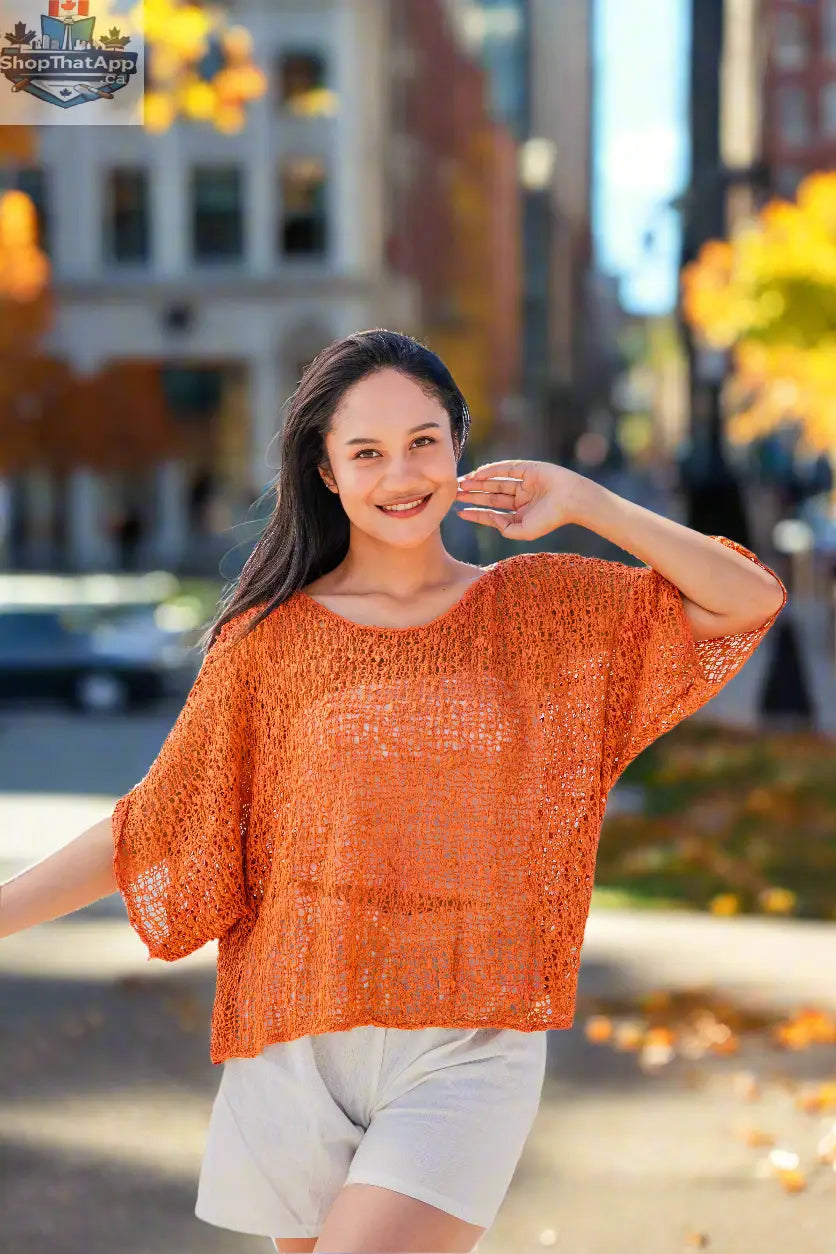 Vibrant orange knit top by Suzie Blue Canada featuring popcorn knit pattern, cozy and stylish for everyday wear.