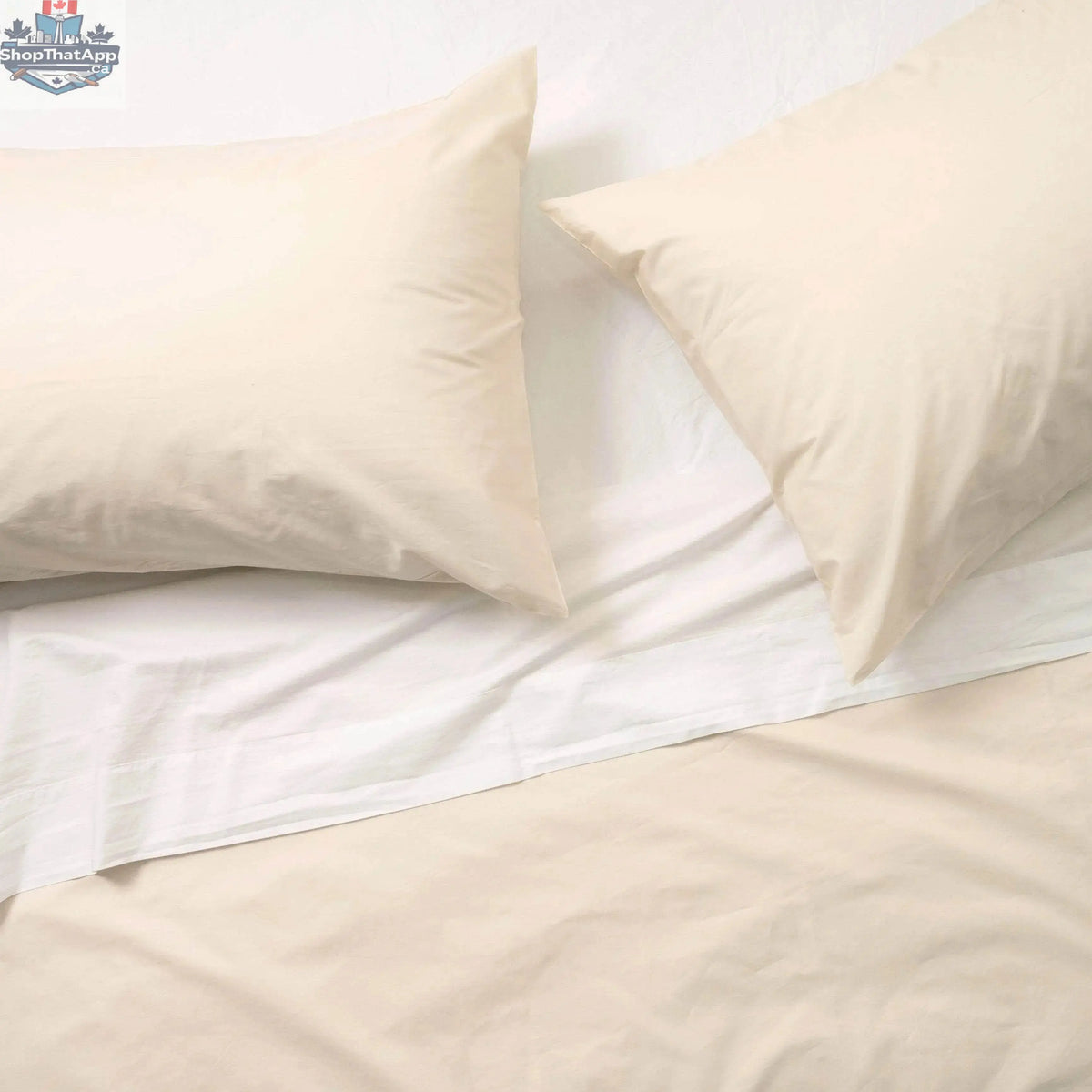 Luxurious organic percale sheets from Skylark+Owl Canada, featuring a crisp, breathable sheet set with a smooth, white finish.