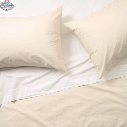 Luxurious organic percale sheets from Skylark+Owl Canada, featuring a crisp, breathable sheet set with a smooth, white finish.