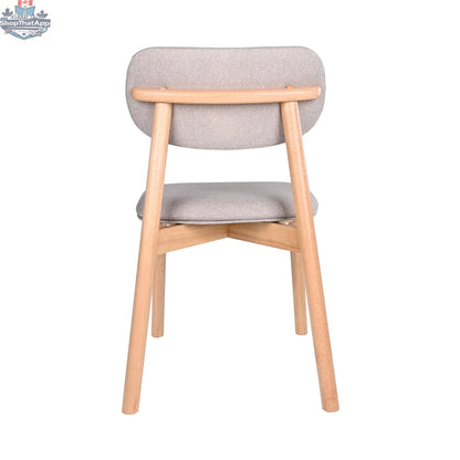 Hygge Design House Alva dining chair with wooden legs and upholstered seat, modern and stylish for kitchen or dining room.