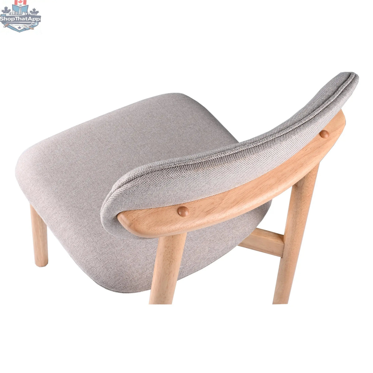 Hygge Design House Alva dining chair with wooden legs and upholstered seat, modern and stylish for contemporary dining rooms.