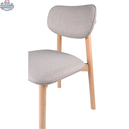 Hygge Design House Alva dining chair with wooden legs and upholstered seat, modern and stylish for contemporary dining rooms.