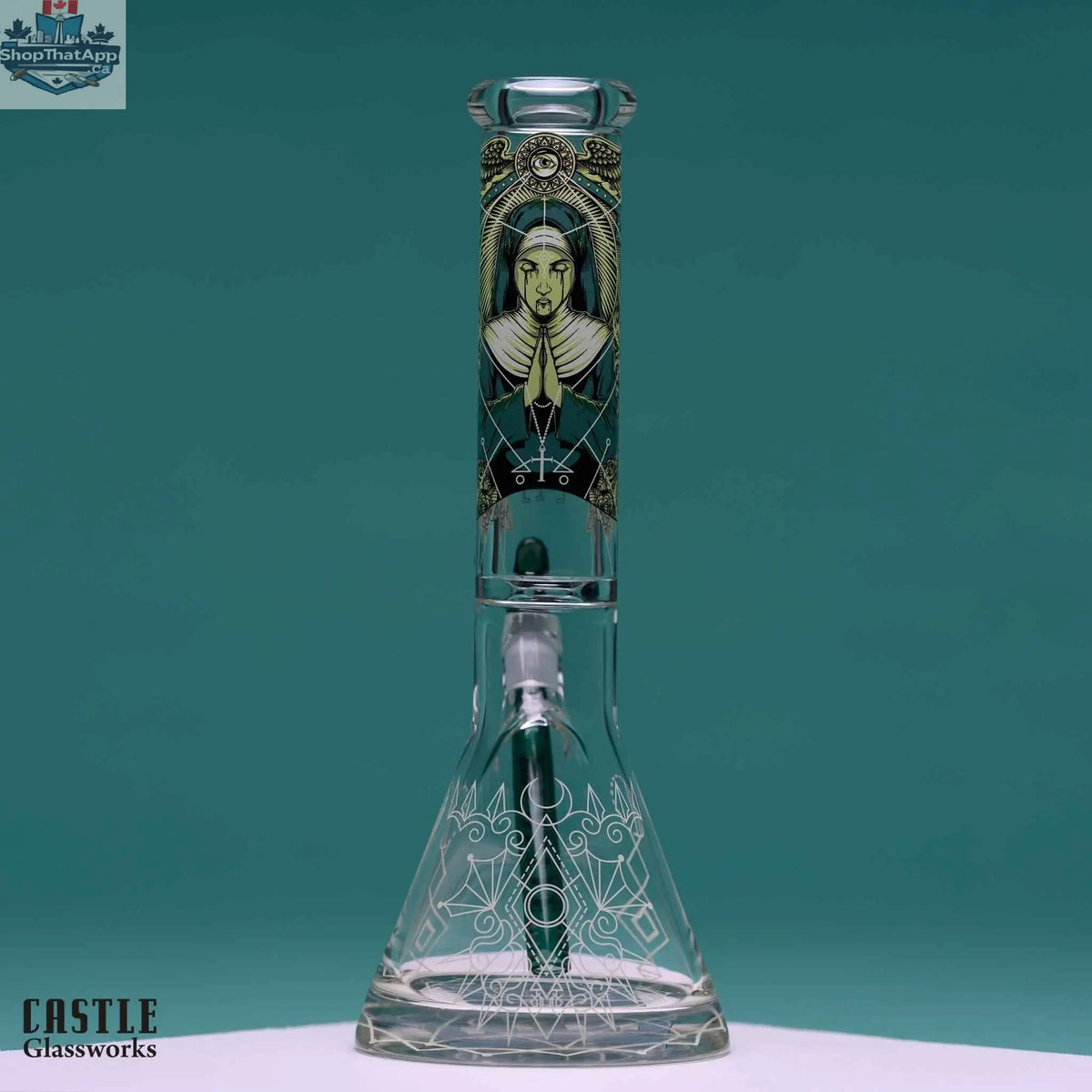 14-inch Castle Glassworks beaker bong with occult graphic design and 9mm thick glass, featuring a clear beaker shape.