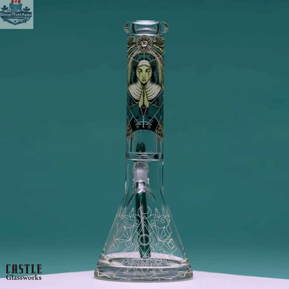 14-inch Castle Glassworks beaker bong with occult graphic design and 9mm thick glass, featuring a clear beaker shape.