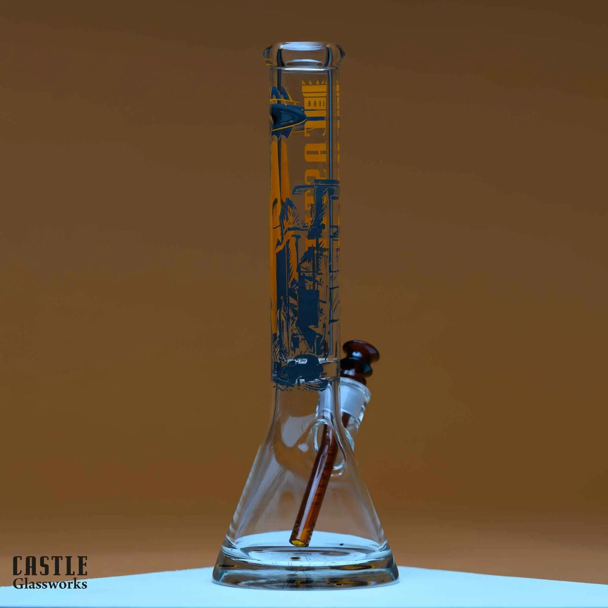 Castle Glassworks 16-inch UFO beaker glass bong with extraterrestrial design, featuring a clear glass body and intricate details.