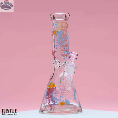 Castle Glassworks 12-inch beaker bong made of 9mm thick glass with a jellyfish design, featuring a sturdy beaker shape.