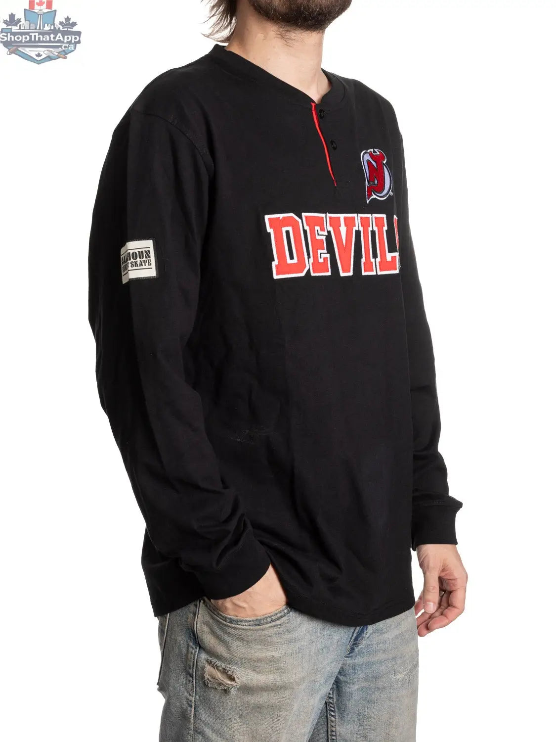 New Jersey Devils long sleeve henley shirt by Calhoun Surf N' Skate, featuring team logo and side view of the stylish fan apparel.