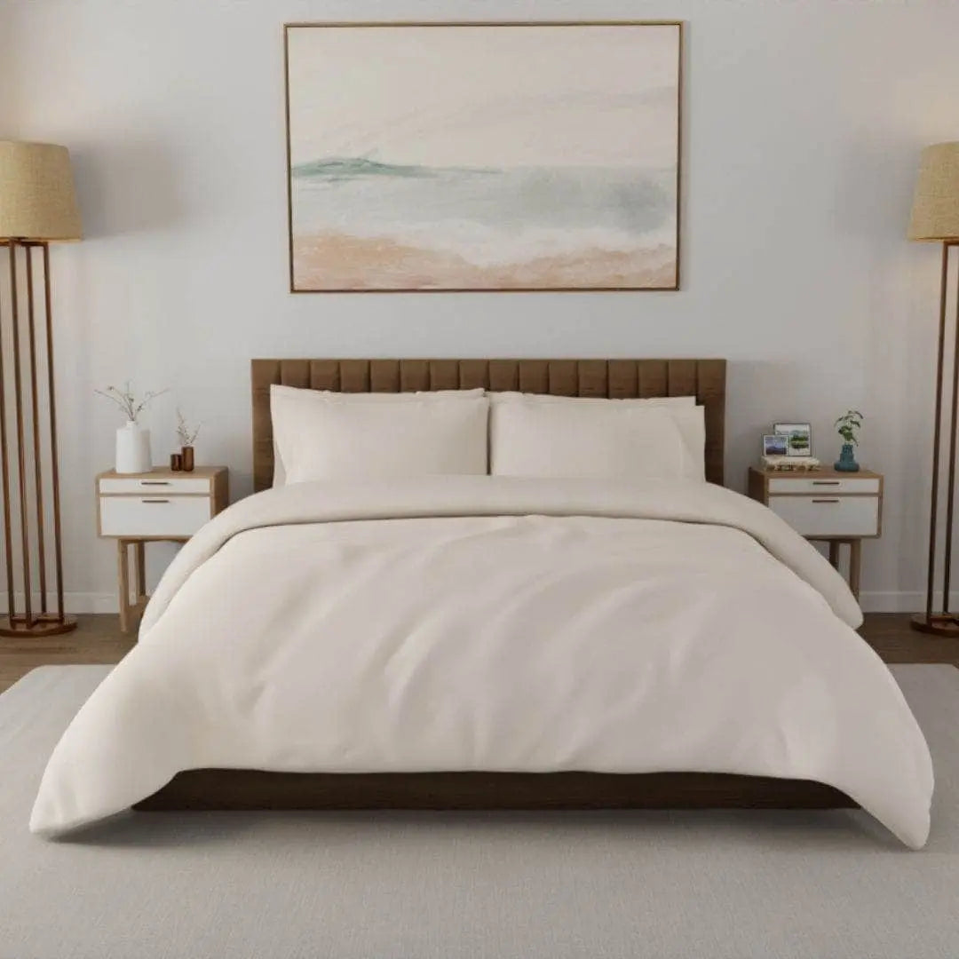 Cream-colored organic percale duvet cover with subtle dune pattern from Skylark+Owl Canada, designed for comfort and style.