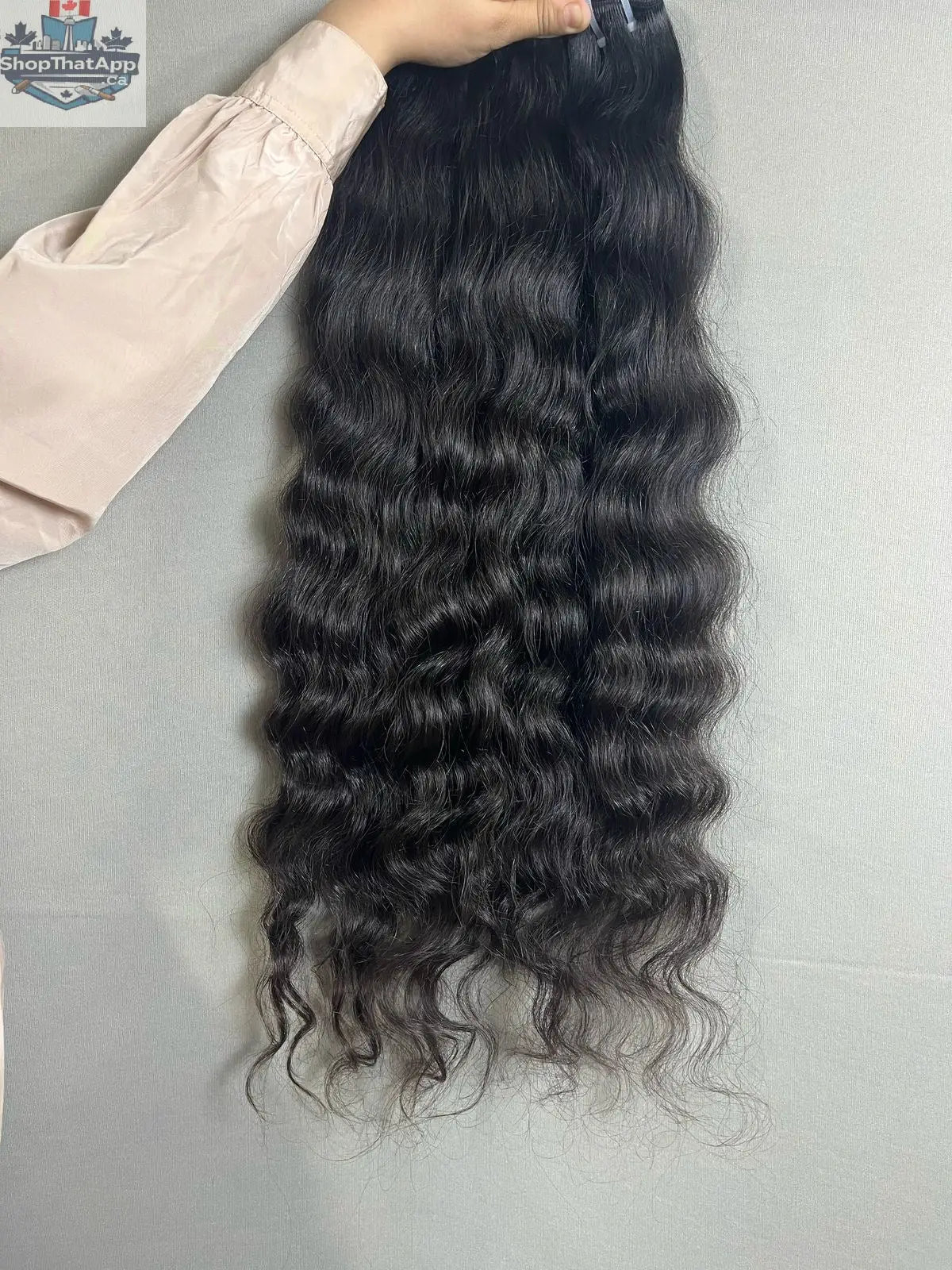 Indian raw curly hair bundles from Prithvi Mart, natural unprocessed human hair extensions with rich, curly texture.