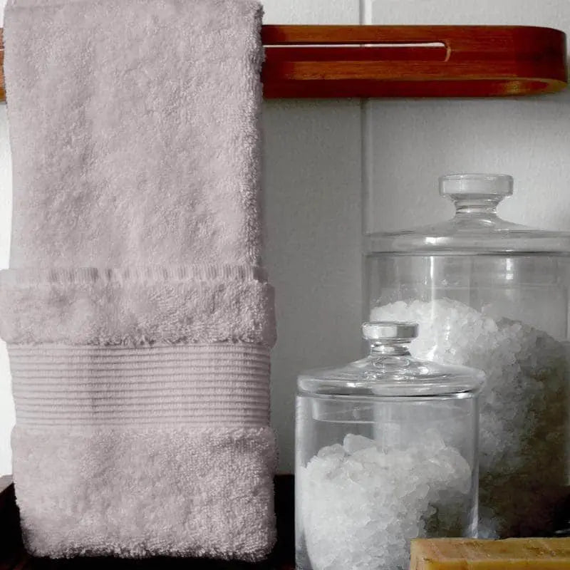 Light grey Essence Turkish towel by Skylark+Owl Canada hanging, showcasing soft, luxurious, and versatile Turkish towel for home or travel.