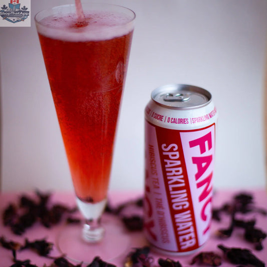 Fancy Sparkling Water Hibiscus Berry sparkling tea in a clear glass, showing vibrant red color and effervescent bubbles.