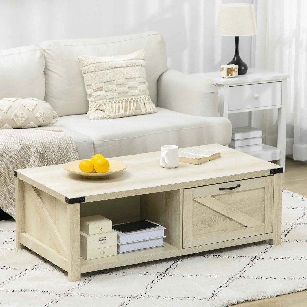 Lowen farmhouse coffee table by SLOTH Nation with white oak finish, featuring a drawer and open storage shelf.