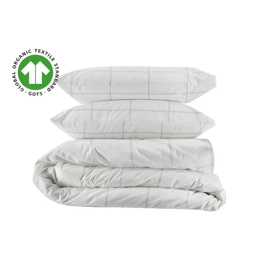 Organic percale duvet cover set with pillowcases from Skylark+Owl Canada, featuring a crisp, white, GOTS-certified bedding design.