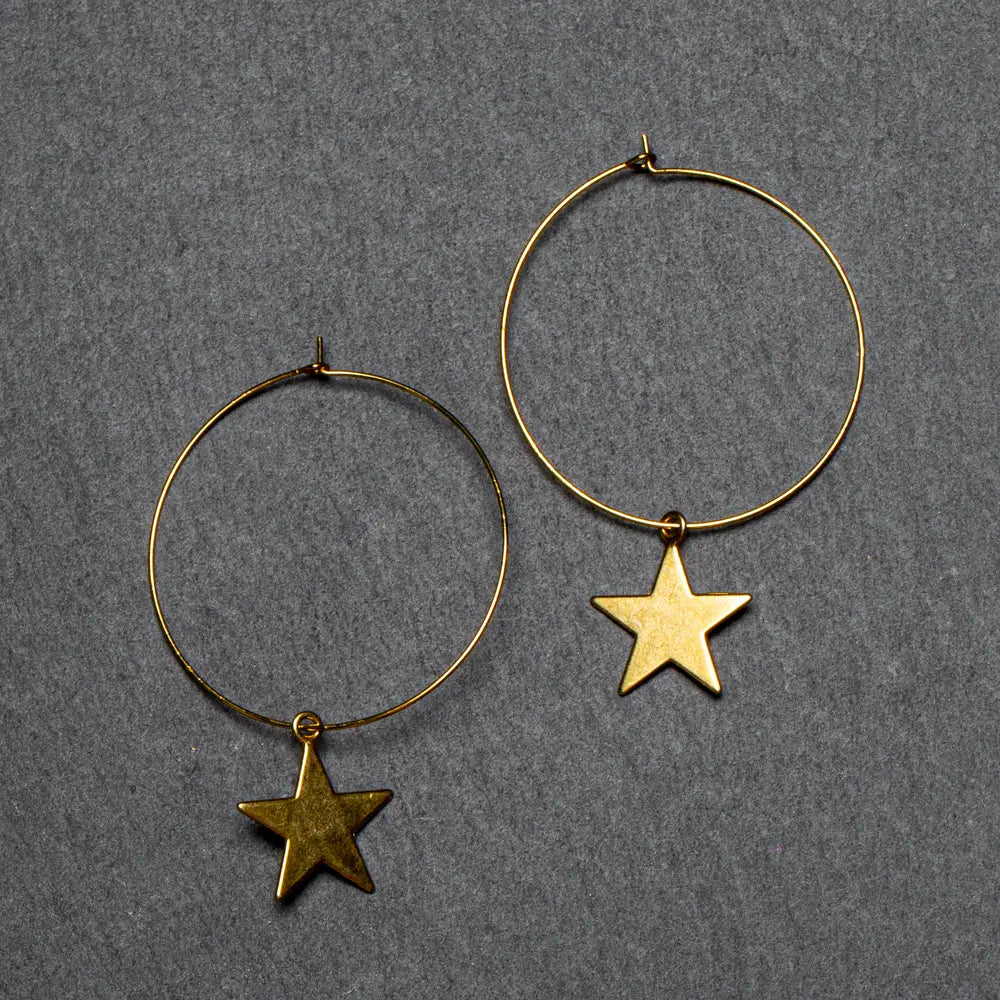 Gold plated star hoop earrings from Suzie Blue Canada featuring a stylish and elegant jewelry design.