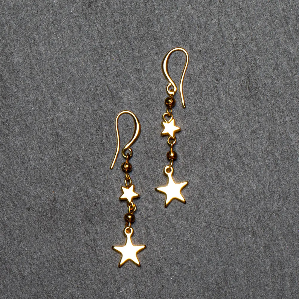 Gold-plated star drop earrings by Suzie Blue Canada featuring a stylish and elegant design forAccessorizing.