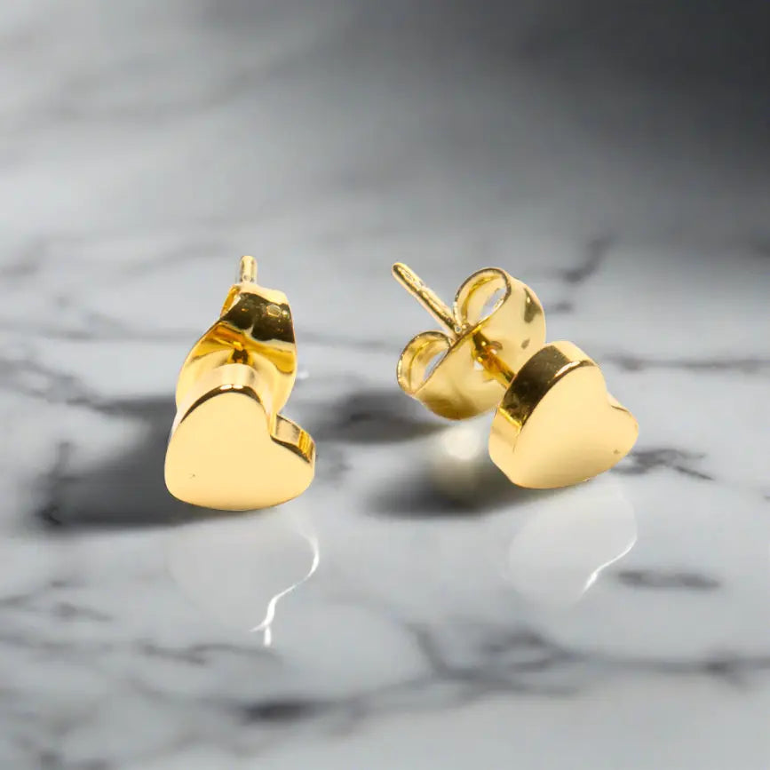 Gold heart stud earrings by Suzie Blue Canada, elegant gold-plated jewelry with a delicate heart design.