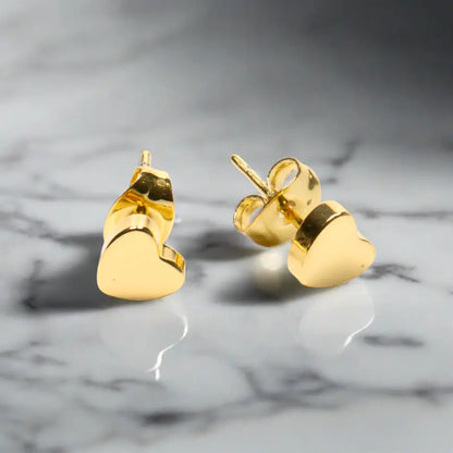 Gold heart stud earrings by Suzie Blue Canada, elegant gold-plated jewelry with a delicate heart design.