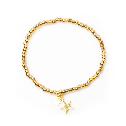 Gold star charm bracelet with elasticated design, gold plating, by Suzie Blue Canada, featuring a delicate star pendant.