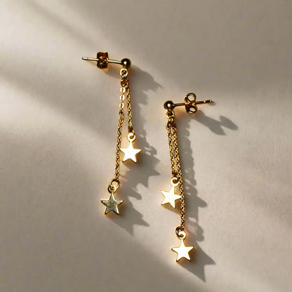 Gold plated double drop star earrings with elegant chain design by Suzie Blue Canada, featuring star-shaped charms and delicate links.