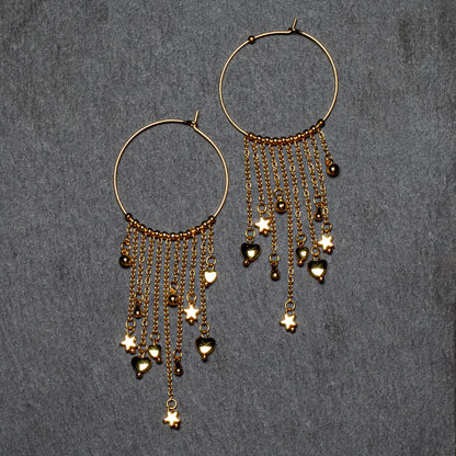 Gold plated ring and charms earrings by Suzie Blue Canada featuring elegant jewelry design on a white background.
