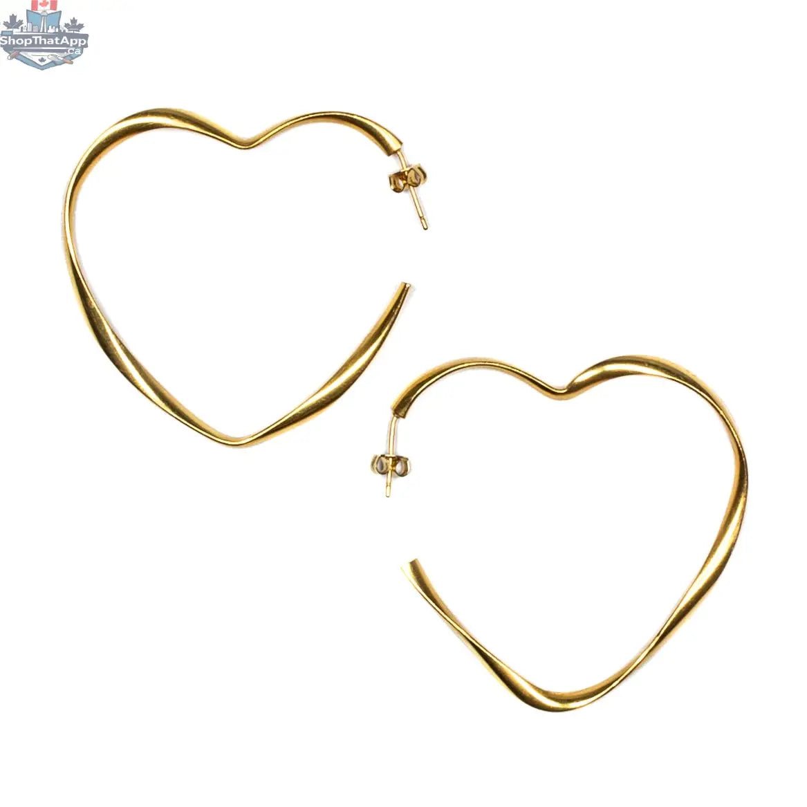 Large gold heart hoop earrings by Suzie Blue Canada featuring bold, statement jewelry with a chic heart-shaped design.