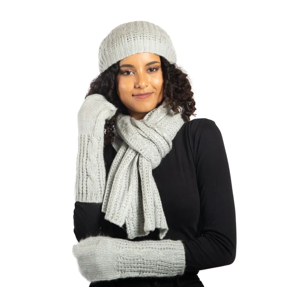 Gray cable knit hat by Suzie Blue Canada, featuring cozy, textured wool blend and stylish design for warmth and fashion.