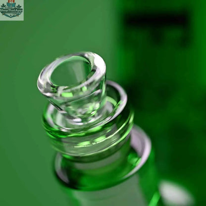 Green 14-inch beaker bong by Castle Glassworks with heavy-duty electroplated glass and a close-up bowl on a green background.